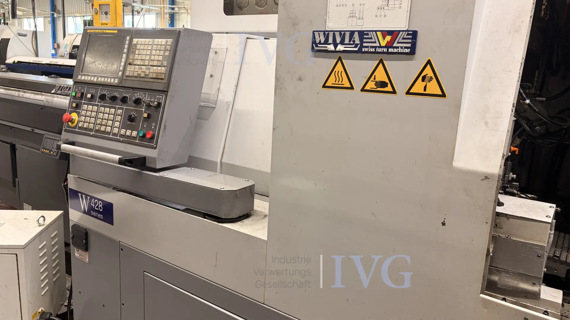 CNC-Langdrehmaschine mit Stangenlader WIVIA W428 – foto 2 – kavel bij IVG, Mahlstetten